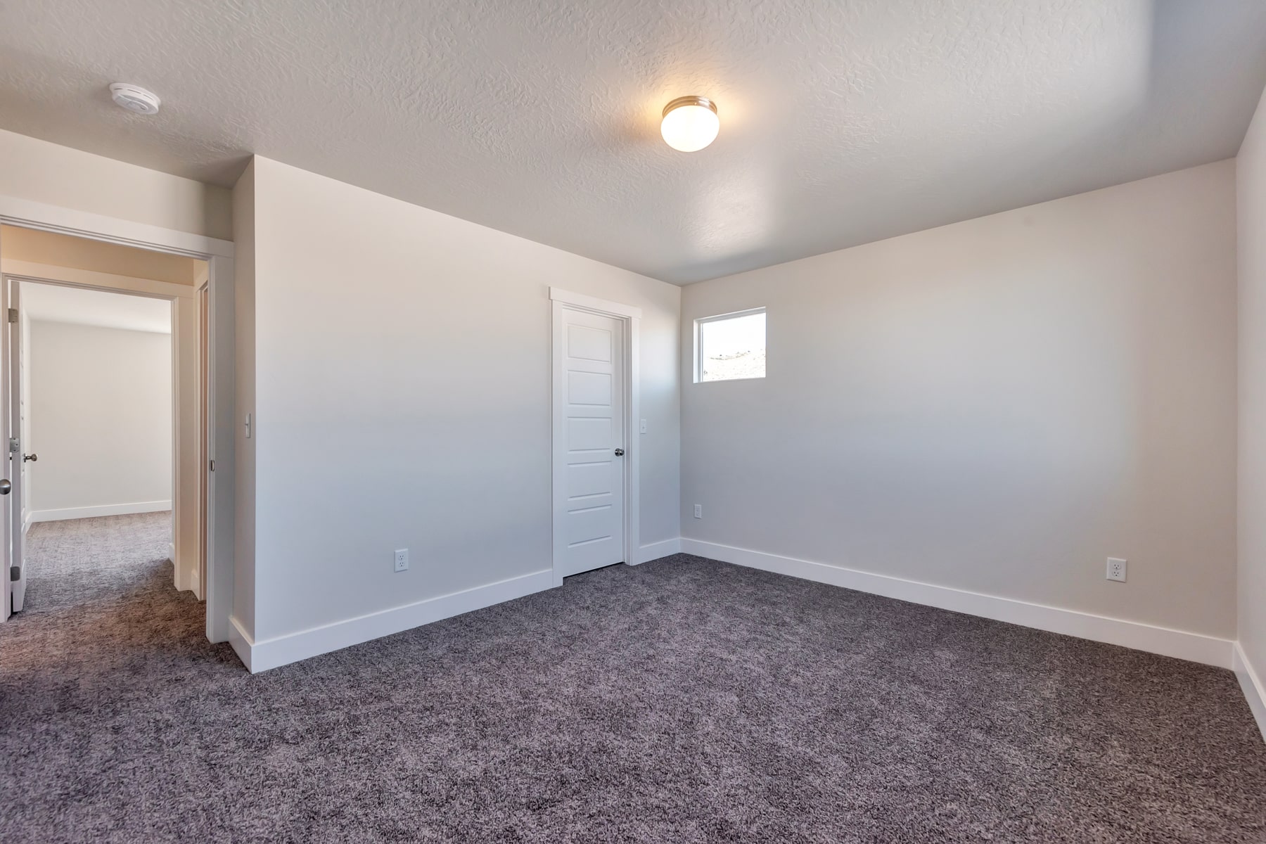 Bedroom in a new home from McArthur Homes.