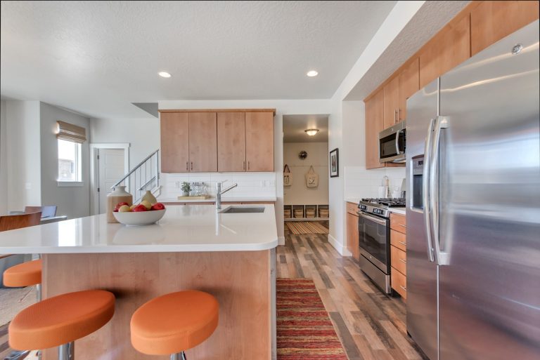 Kitchen area with brown cabinets from mcarthur homes