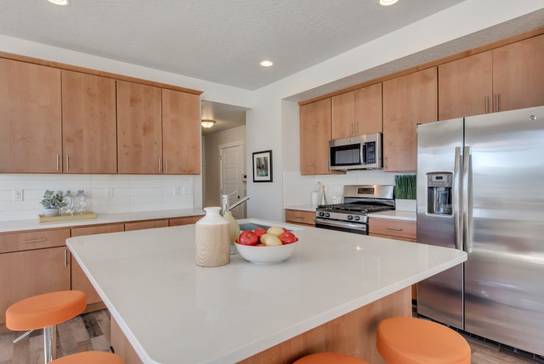 Kitchen area with brown cabinets from mcarthur homes