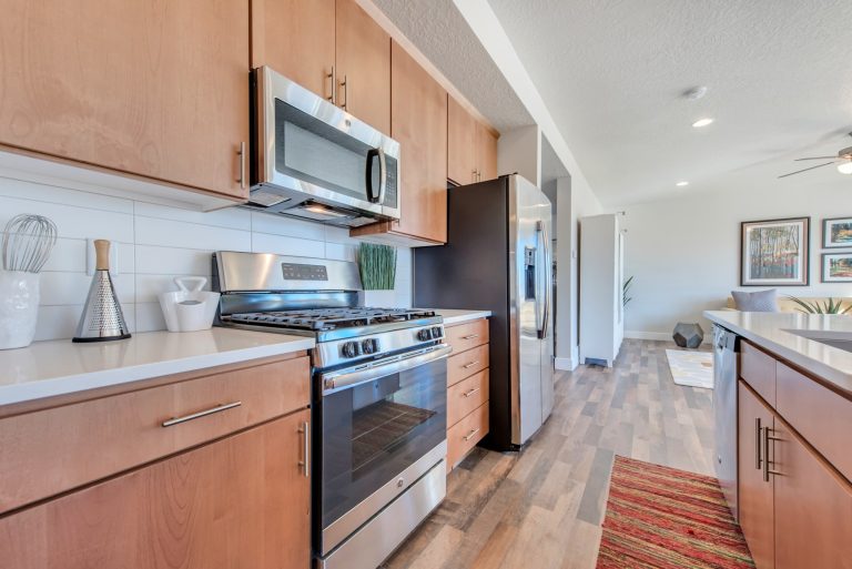 Kitchen area with brown cabinets from mcarthur homes