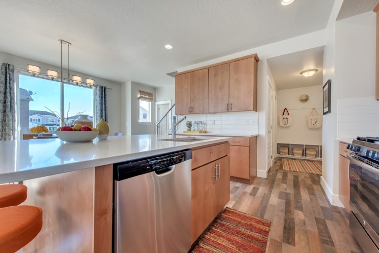 Kitchen area with brown cabinets from mcarthur homes