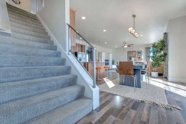 Staircase leading up from mcarthur homes
