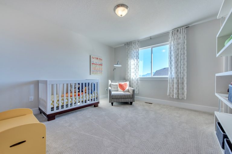 Bedroom with crib in it from McArthur Homes