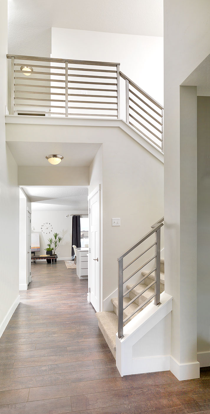 a gorgeous stairway in a home built by McArthur Homes