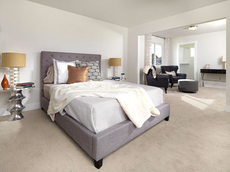 a completed and furnished master bedroom built by McArthur Homes