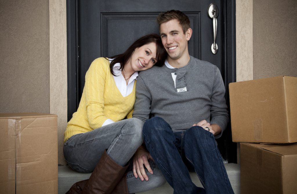 Young couple moving into their home built by McArthur Homes