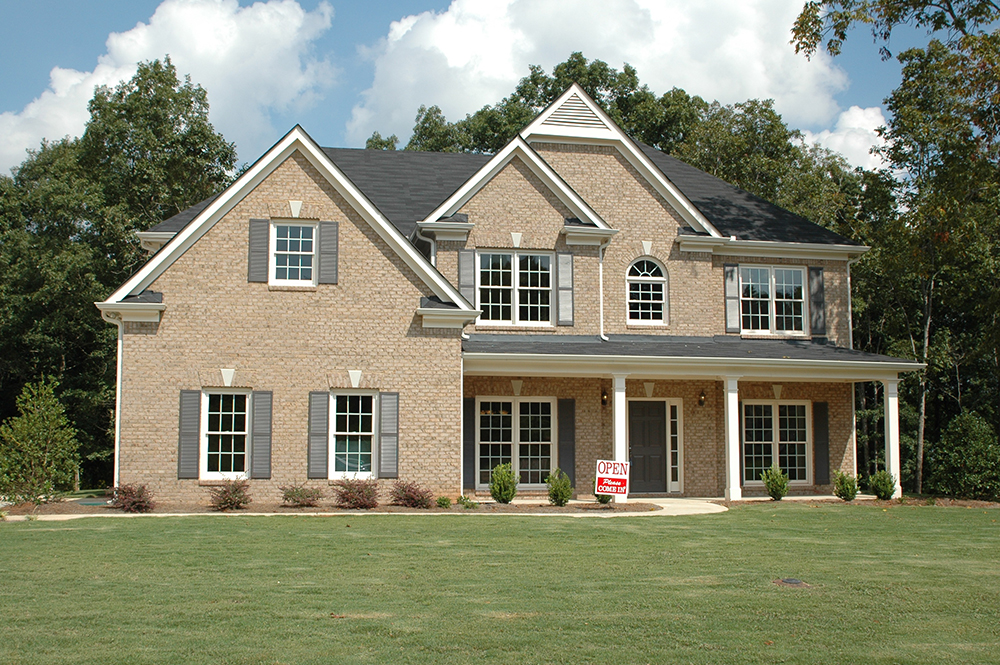 A home with a for sale sign