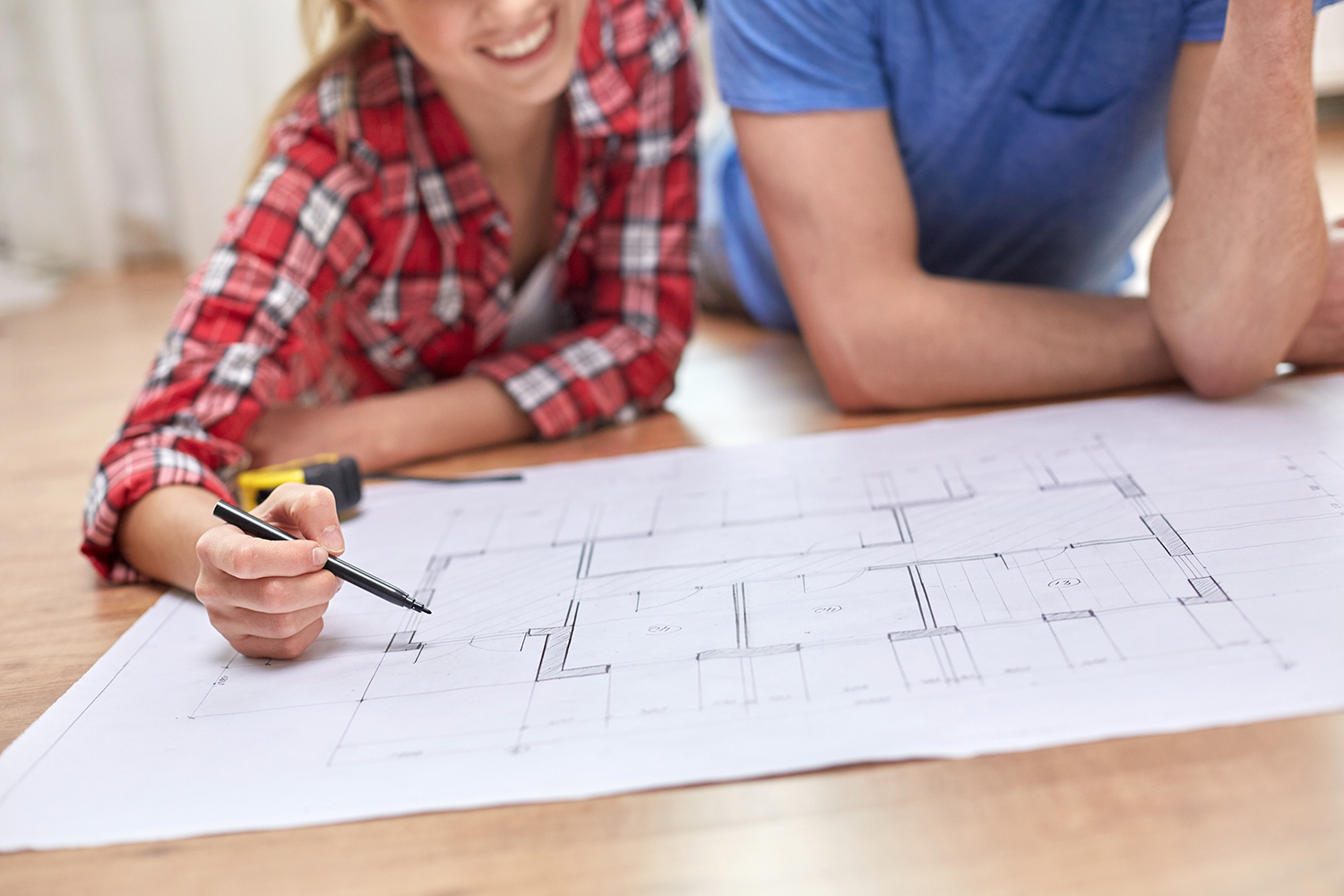 Couple looking at blueprints