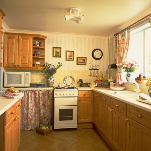 1990s kitchen with orange pine cabinets