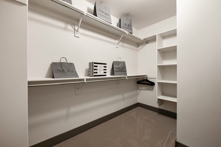 walk in closet with built in shelves Inside A New Home From McArthur Homes