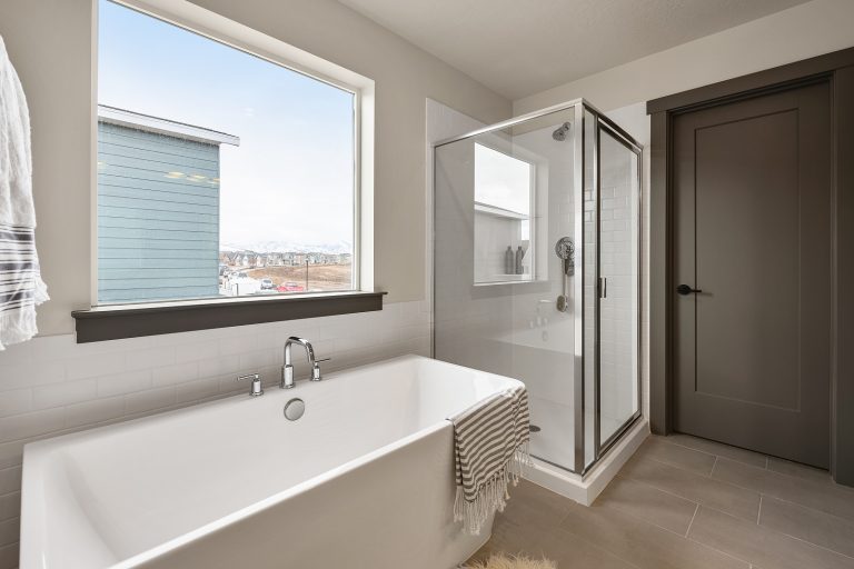 Bathroom with separate shower and tub Inside A New Home From McArthur Homes