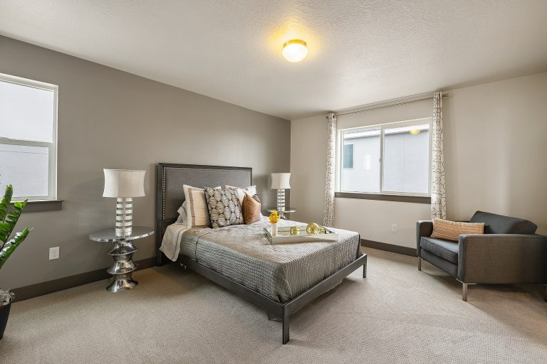 Bedroom with carpet Inside A New Home From McArthur Homes