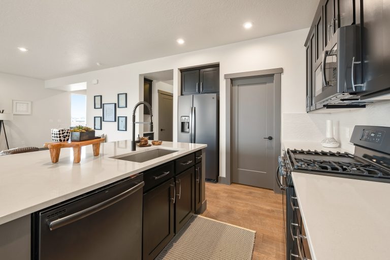 Kitchen With An Island Inside a New Home From McArthur Homes