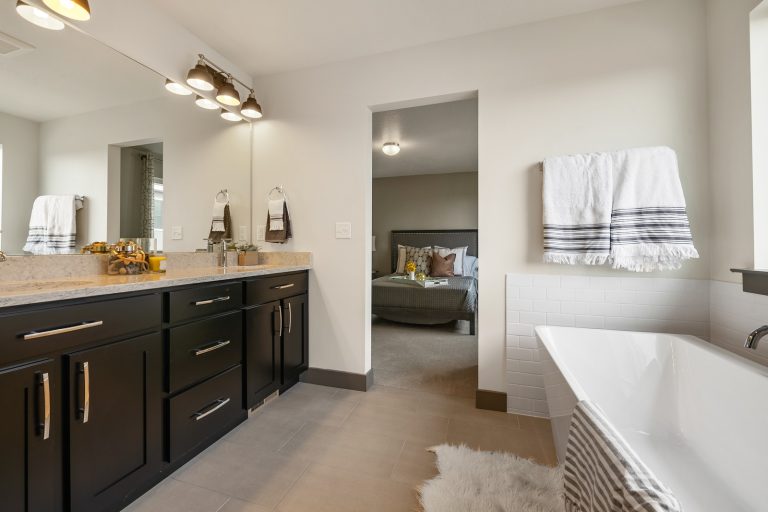 Full bathroom attached to a bedroom Inside A New Home From McArthur Homes