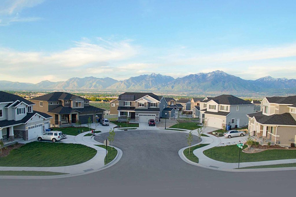 Street with custom mcarthur homes on it