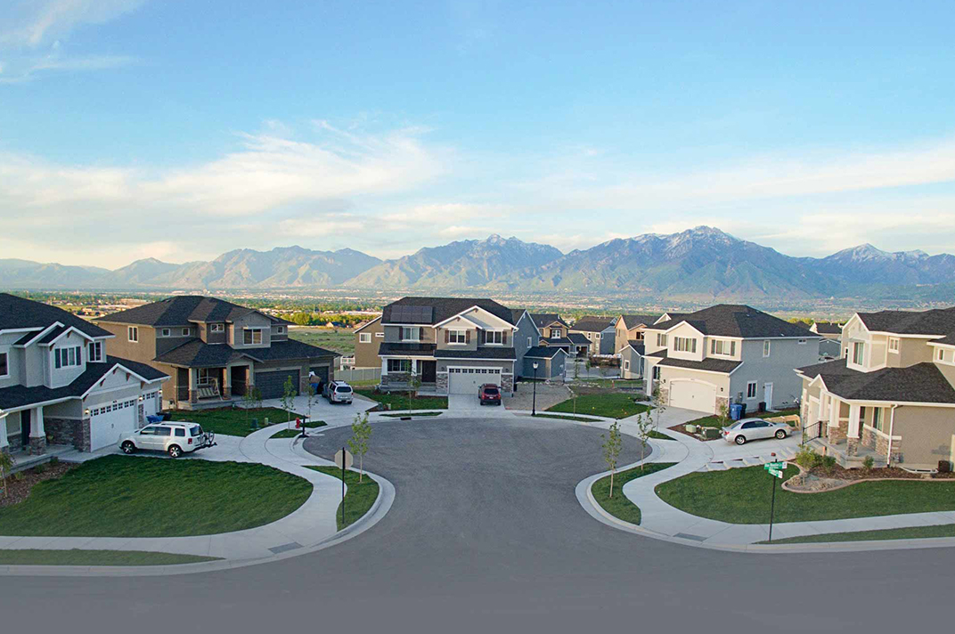 Street with custom mcarthur homes on it