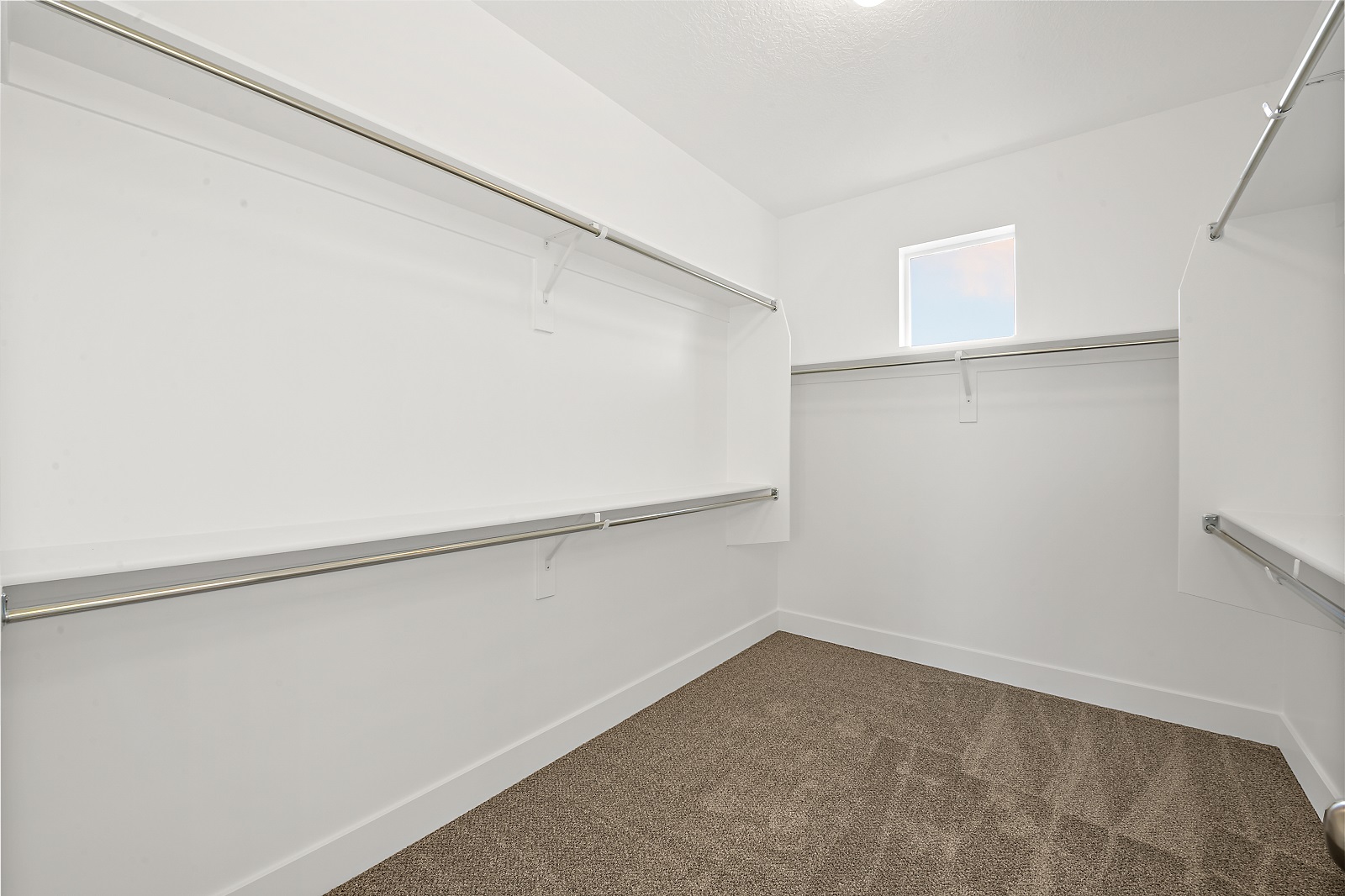 A walk in closet inside a new home built by McArthur Homes.