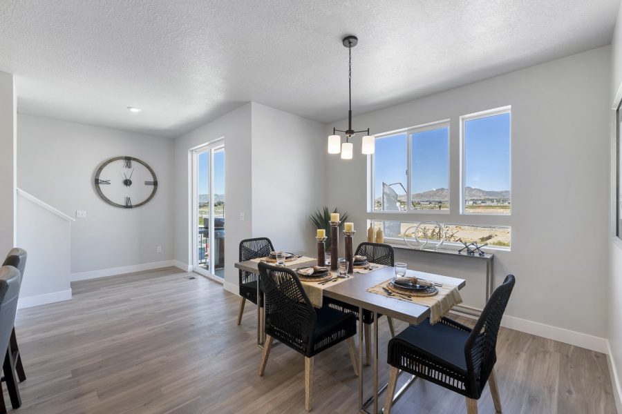 Dining Nook With Table with 4 Chairs Next to a Window
