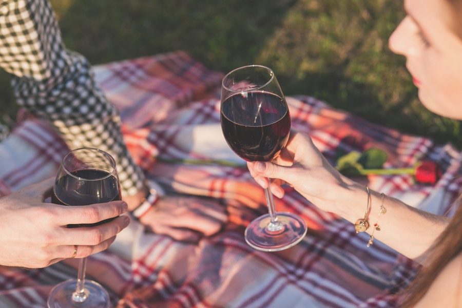 Two People Having A Picnic With Wine 