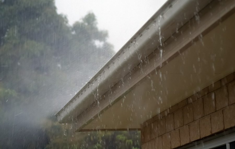 Rain Gutters With Water Flowing From Them