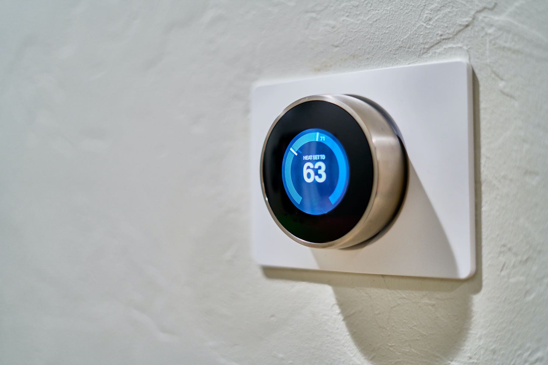Programable Thermostat With the Temperature Set to 63 Degrees