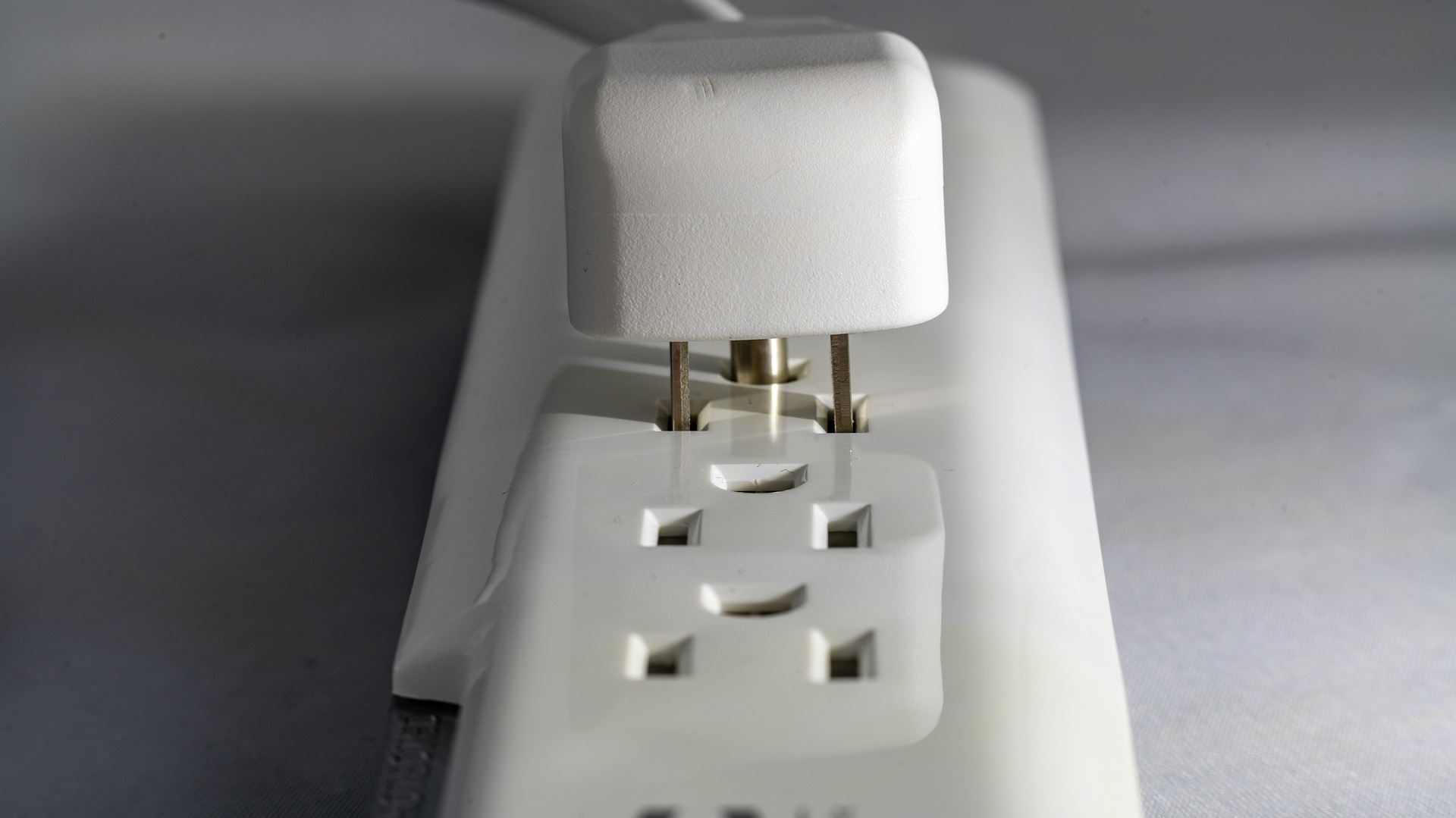 Power Cable Being Unplugged from Power Strip