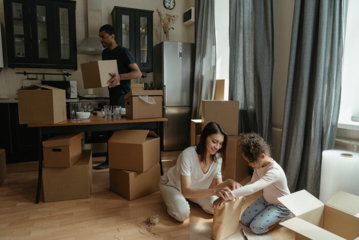 A Couple with A Young Girl Getting Ready To Move To A New McArthur Home