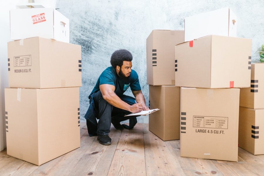 Professional Mover Taking Inventory of Boxes