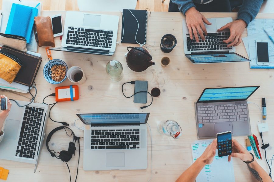 People Working on Laptops and Phones