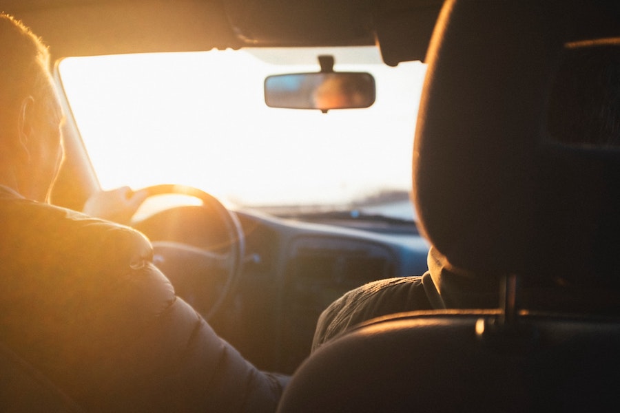Person Driving in Car to Work