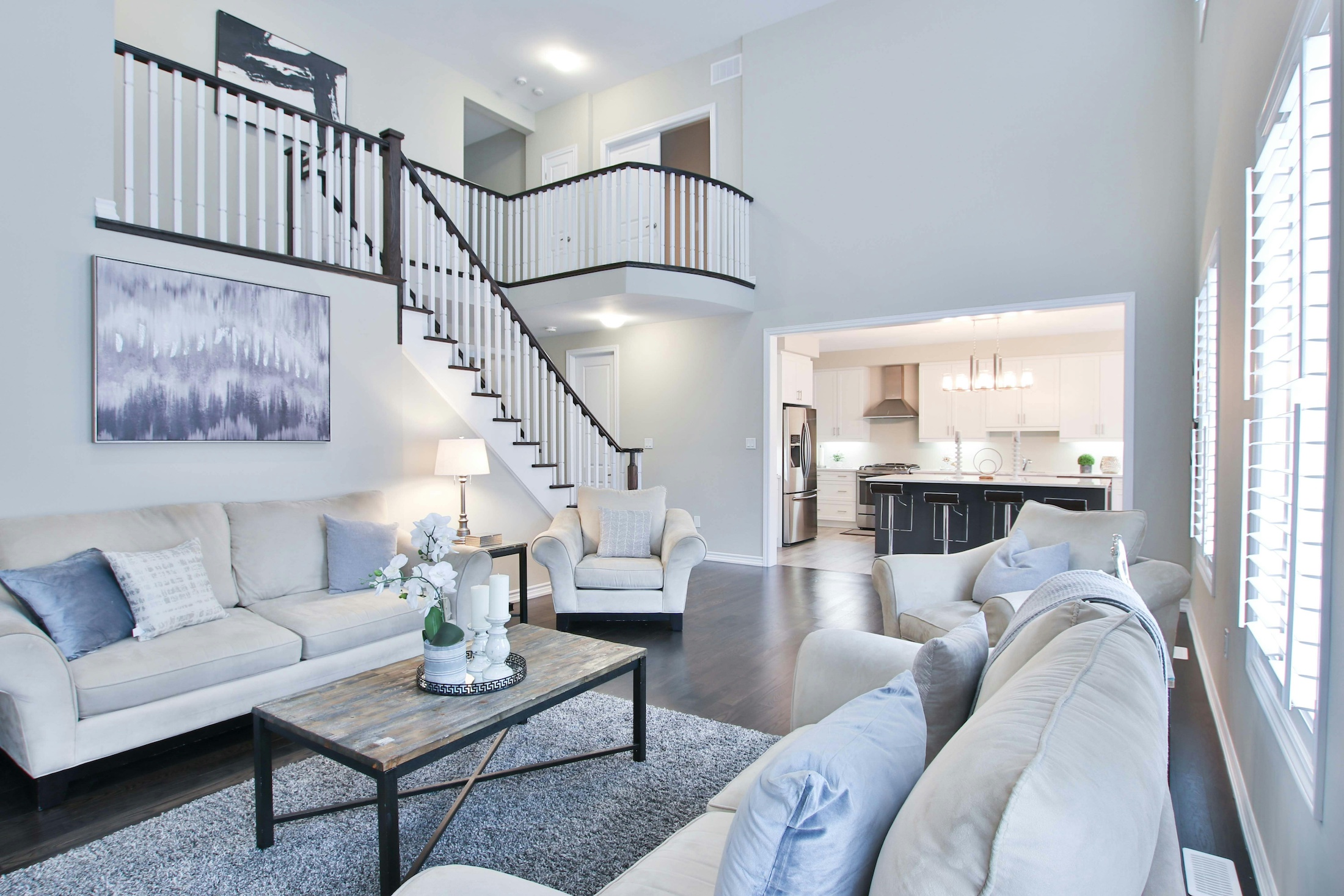 Loft space in a new home with white couch