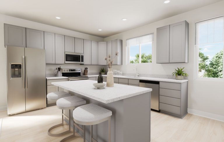 Modern kitchen with light gray cabinets, stainless steel appliances, and a large island with three upholstered stools—showcasing the inviting style found in many homes in Utah. White countertops and natural light enhance the space, accented by decorative plants and vases.