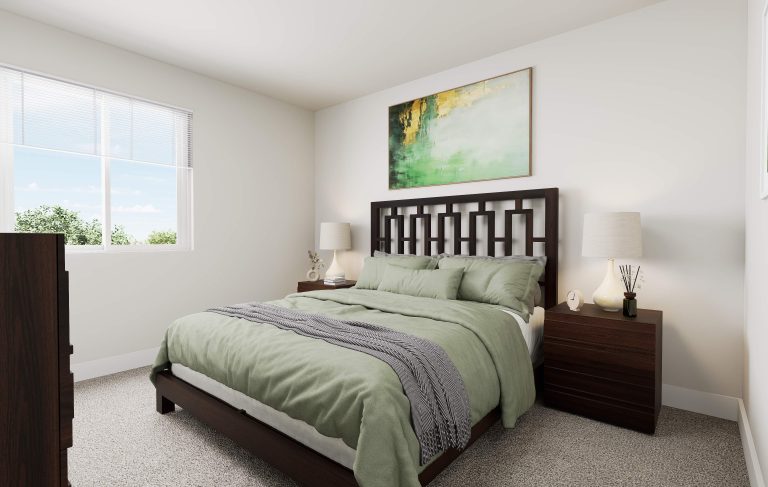 A modern bedroom often found in homes in Utah features a large window, bed with green bedding, dark wood nightstands with lamps, and a bold abstract painting above the headboard. The room is bright with neutral walls and carpet.