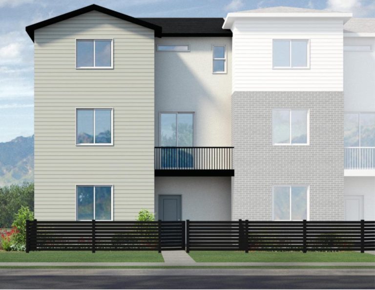 A modern three-story townhouse with beige siding, large windows, a small balcony on the second floor, and a black horizontal slat fence in front—typical of the stylish homes in Utah—flanked by similar townhouses.